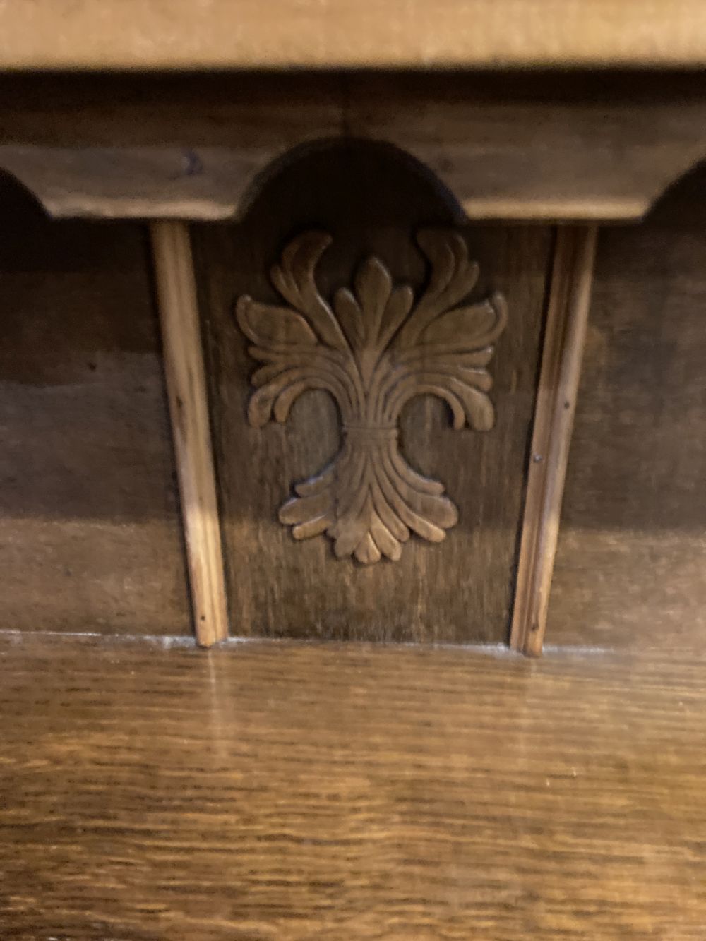 A 1930s oak Gothic inspired sideboard, width 180cm depth 50cm height 116cm